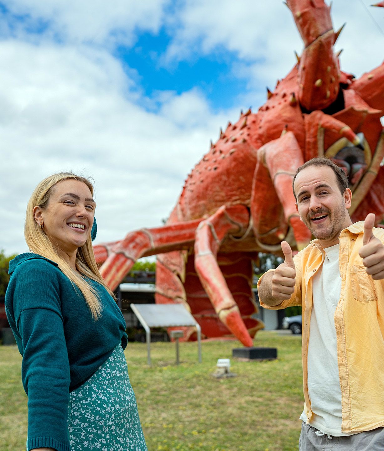 two teachers in front of a giant lobster at kingston SA